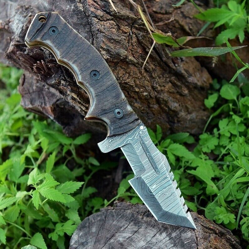 Damascus steel folding pocket knife with leather case.