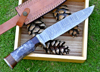 Hunting Bowie knife with Damascus steel blade, Colored Bone and Rosewood handle, Damascus guard, and leather sheath. Ideal for outdoor adventures and hunting expeditions.