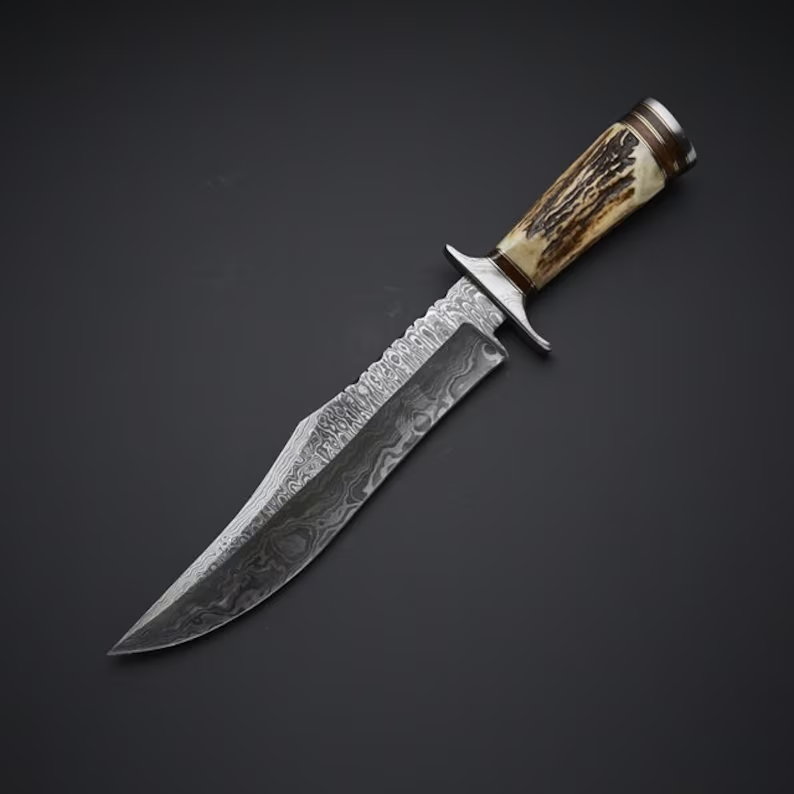 Bowie knife with Twist Damascus steel blade, Antler Horn handle, and steel guard, presented with a leather sheath.