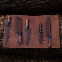 Elegant leather roll containing a full set of kitchen knives