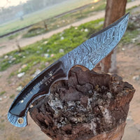 Custom handmade 8.5-inch Fire Damascus steel knife with leather sheath.
