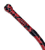 Close-up of the cowhide leather handle showcasing the craftsmanship of the bull whip.
