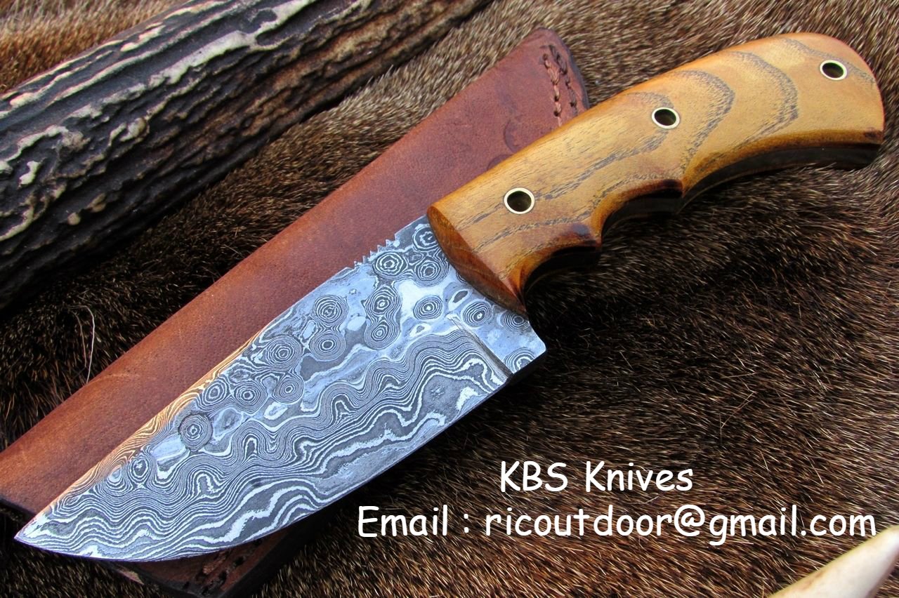 8.5-inch Damascus steel drop point skinning knife with a native wood handle.
