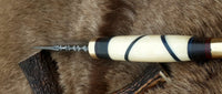 Unique hunting knife with camel bone handle and vibrant color sheets
