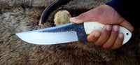 10.5-inch hunting knife with sharp edge and leather sheath
