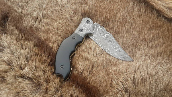 Damascus steel folding knife