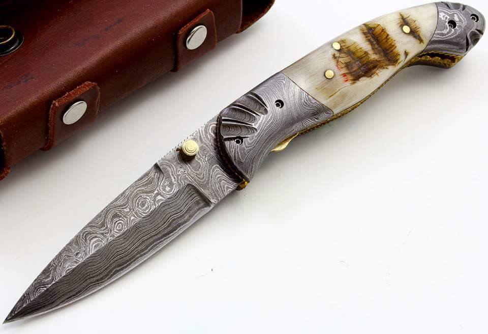 Everyday Carry Damascus Steel Pocket Knife with mountain ram horn handle and Damascus bolsters.