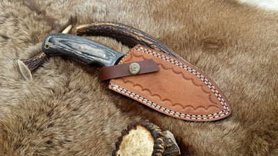 Premium handmade hunting knife with exotic wood handle for outdoor use
