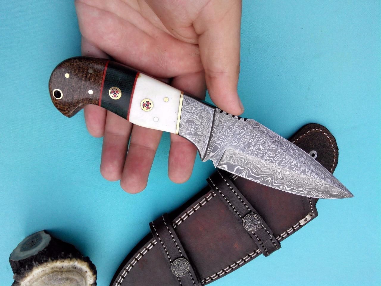 Custom Handmade Damascus Hunter’s Edge Hunting Knife on a leather sheath
