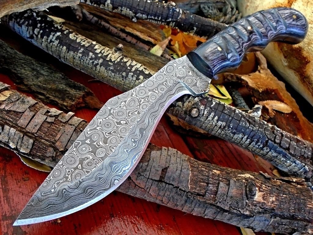 Full Tang Damascus Steel Gurkha Kukri with Exotic Pakka Wood Handle and Leather Sheath.
