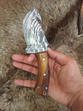 Custom handmade Guthook knife with rosewood handle on display
