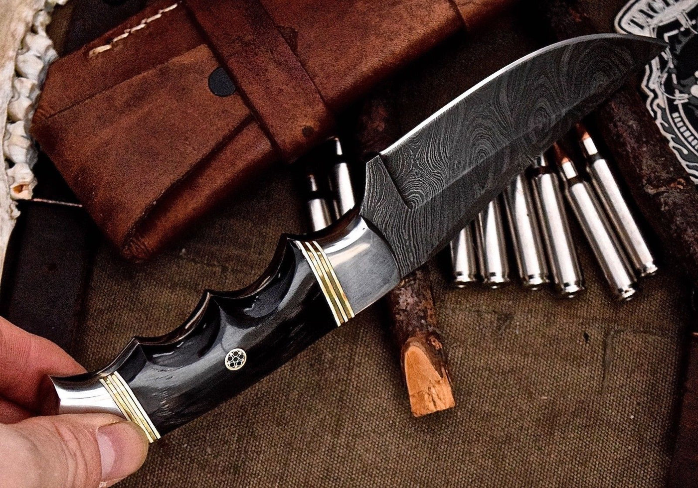 "Close-up of the Damascus steel blade displaying intricate patterns."





