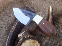 Hand-forged 6-inch deer skinning knife with 3-inch drop point blade and rosewood handle.
