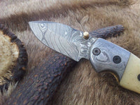 Custom handmade 2.5-inch Damascus steel blade with bone handle and leather sheath