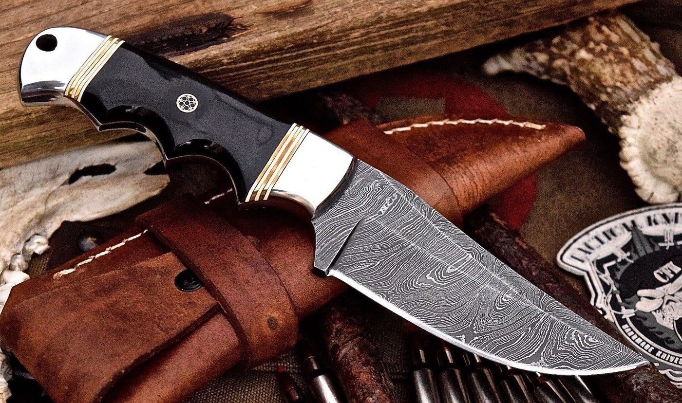 "Buffalo horn handle of the deer hunting knife featuring steel bolsters."
