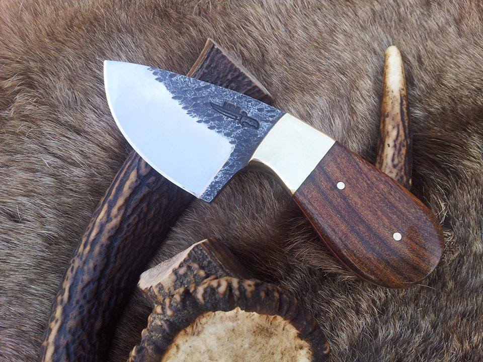 Custom 6-inch hand-forged 1095 steel field dressing knife with rosewood handle.
