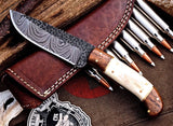 "Custom hunting knife with a hand-forged Damascus steel blade."
