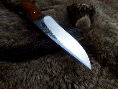 Close-up of 1095 tool steel blade on KBS Knives hand-forged hunting knife
