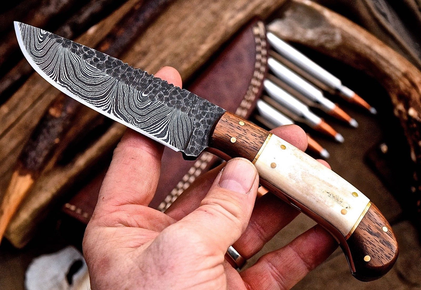 "Close-up of the rosewood and bone handle on the custom hunting knife."
