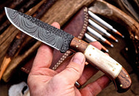 "Close-up of the rosewood and bone handle on the custom hunting knife."
