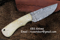 Fixed blade skinning knife displayed with its leather sheath for protection and convenience.