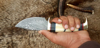 9-inch custom hunting knife featuring a sharp edge and leather sheath
