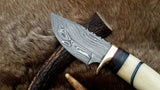 Damascus steel blade hunting knife with colorful sheets and brass guard
