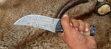 Handmade hunting knife with protective leather sheath for safe transport





