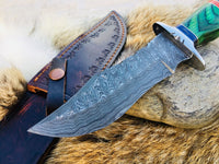 "Detail of Damascus steel blade on custom hunting knife."





