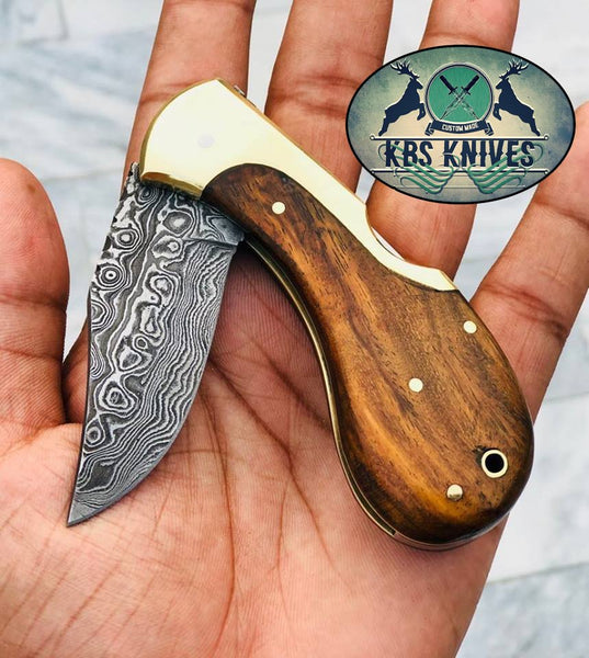 Custom Handmade Damascus Steel New Folding Pocket Knife with Rosewood Handle and Leather Case by KBS Knives Store.