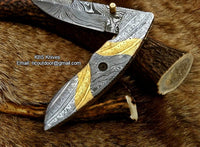 Hand-engraved steel and brass handle on The MasterCraft folding pocket knife

