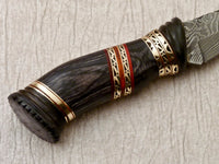 Close-up of 5.5-inch Damascus blade showcasing unique pattern