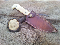 Unique hunting knife with Damascus blade and protective leather sheath
