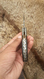 Damascus steel folding knife