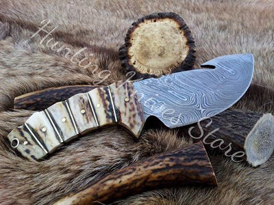 Deer Guthook knife with custom Damascus steel blade and antler horn handle with brass spacers

