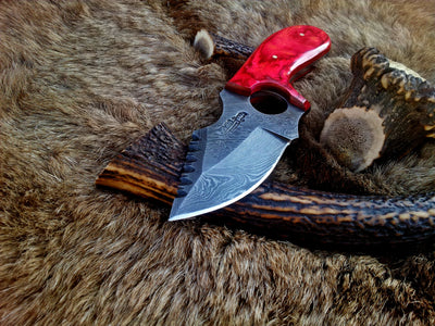 Exotic Pakka wood handle on a custom Damascus steel deer skinning knife.
