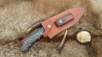 Handmade pig hunting knife with leather sheath for secure transport





