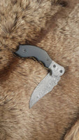 Damascus steel folding knife
