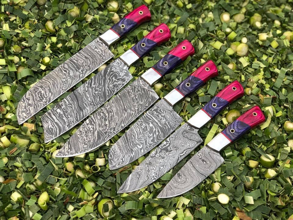 6-piece kitchen knives set with Twist Damascus steel blades, Exotic Wood handles, and steel bolsters, elegantly stored in a leather roll. A culinary masterpiece for every kitchen enthusiast.
