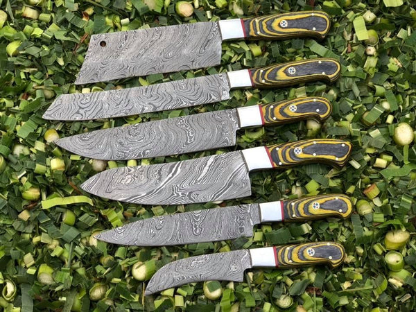 6-piece kitchen knives set with Twist Damascus steel blades, Exotic Wood handles, and steel bolsters, presented in a leather roll. Culinary sophistication at your fingertips.