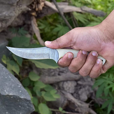 Custom handmade 8-inch Damascus steel knife with leather sheath.