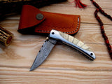 Bone and Steel Elegance pocket knife displaying its liner lock mechanism.
