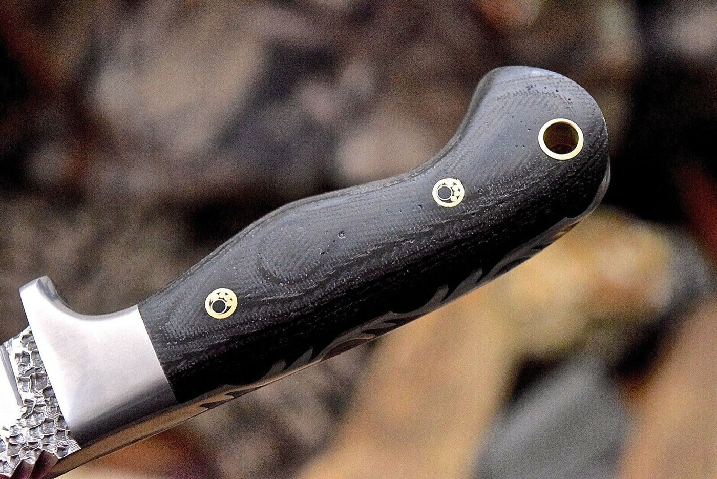 Handmade skinning knife with leather sheath for outdoor use
