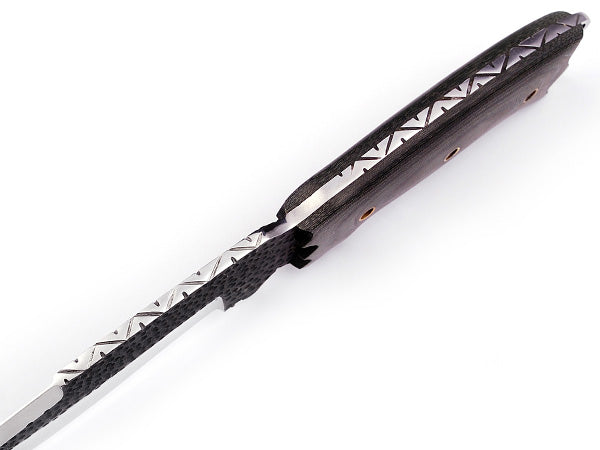 Close-up of 1095 high carbon steel blade pattern on camp knife