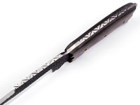 Close-up of 1095 high carbon steel blade pattern on camp knife