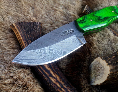 Close-up of Damascus steel blade pattern on bushcraft knife