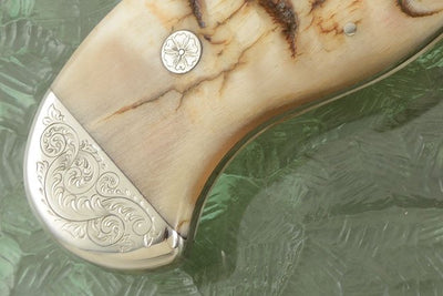 Close-up of the Damascus steel blade and ram horn handle on the Hand Engraved Tennessee Bowie Knife