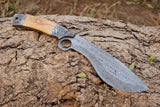 The best kukri knife in action during outdoor tasks like chopping wood.
