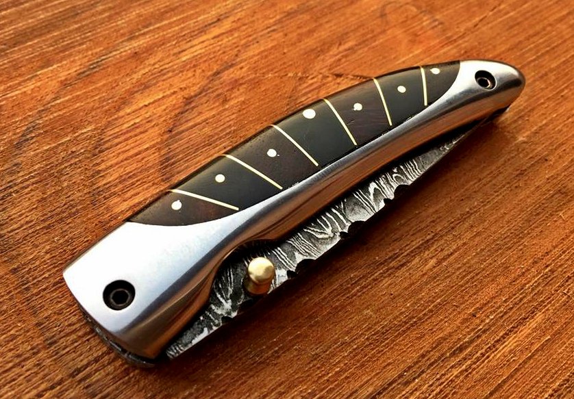 Everyday Carry Damascus Steel Pocket Knife with buffalo horn and steel frame handle.
