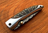 Everyday Carry Damascus Steel Pocket Knife with buffalo horn and steel frame handle.